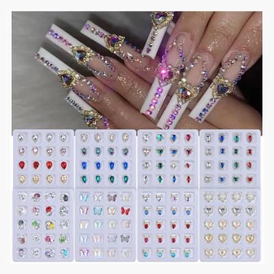 China Nail Art Decoration Supplies 20 Grids Box Alloy Love Shaped Symphony Gem Charm Heart Nail Rhinestone Diamond Jewelry Flatback Crystal Butterfly Nail for sale