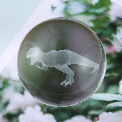 China Unique China JY Design Dinosaur 3d Model Laser Engraved Clear K9 Glass Crystal Balls for sale