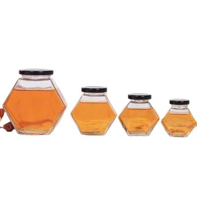 China New Design 180ml Eco-Friendly Recyclable Hexagon Wooden Lid Honey Glass Jar Kitchen Storage Honey Glass Jar With Bamboo for sale