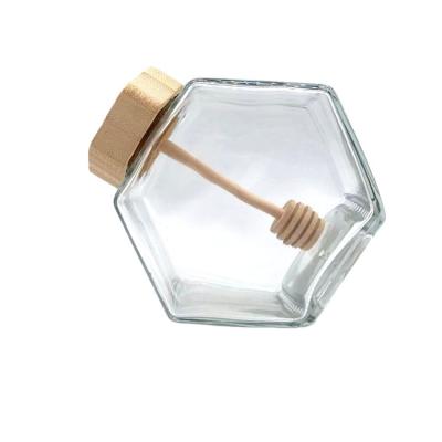 China Food Grade Recyclable Empty Clear Hexagon Glass Bottle Eco-Friendly For Honey Bee 500g Honey Glass Jar With Wooden Cap And Drip Device for sale