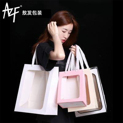 China Cake Bakery Bread Flower Logo Disposable Custom Square Gift Bottom Paper Bags With Ribbon Handles for sale