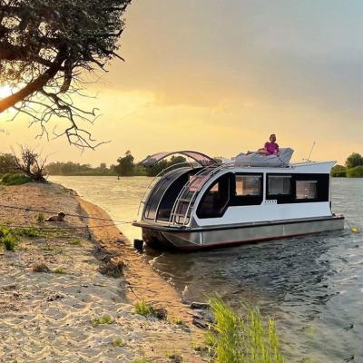 China Floating Cottages Modern Modular Small Hotel Prefab Tiny Houseboat Floating Houseboat With Furniture Motor Solar Catamaran for sale