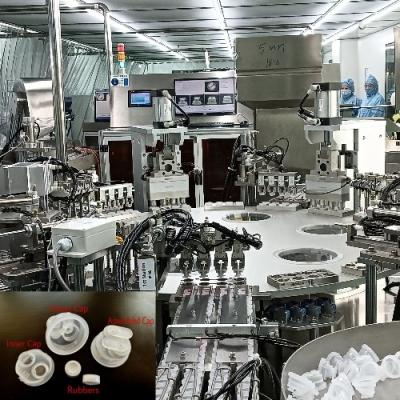 China Turntable Type Infusion Bottle Double-Fold Cap Assembly Machine for sale