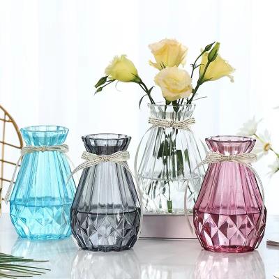 China New Arrival Custom Vertical Blown Decoration Transparent Colored Glass Vase For Flowers for sale