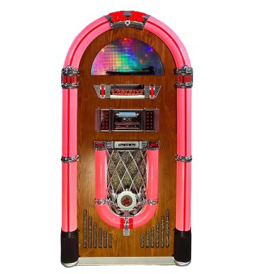 China Home/Bar/Karaoke/ Wall Mounted Coin Operated Desktop Led Colorful Lights Jukebox Fm Radio 10 Meters Blue-tooth Cd Player Retro Jukebox for sale