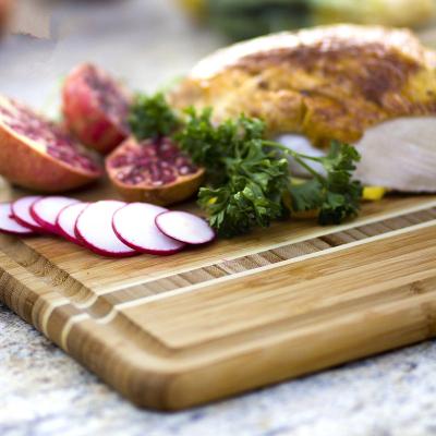 China Viable bamboo cutting board with kitchen unensil for sale