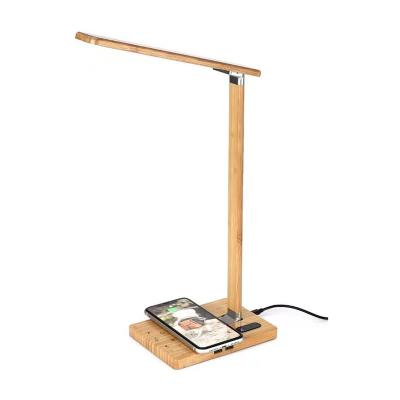 China Smart Watch Multi-angle Folding Desk Lamp Study Light Wooden Charger Wireless Lamp for sale