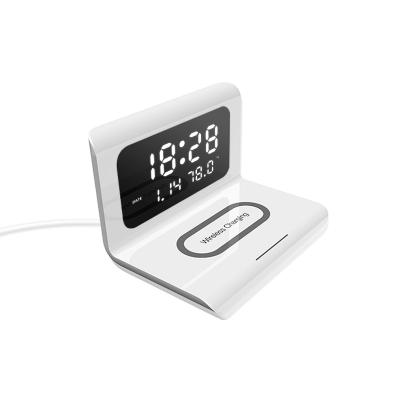 China Multi Function Alarm Clock Table Desktop Bedroom Earphone Phone Wireless Charger for sale