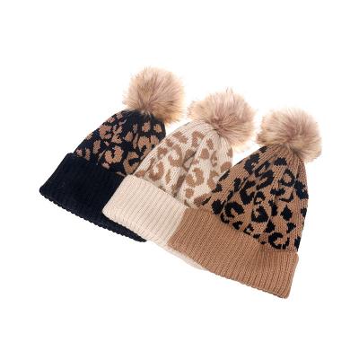 China Winter COMMON Leopard Knitted Pom Pom Girls Beanie Thicken Warm Cap Boy Fashion Pompom Beanies Hats For Women Men Outdoor for sale