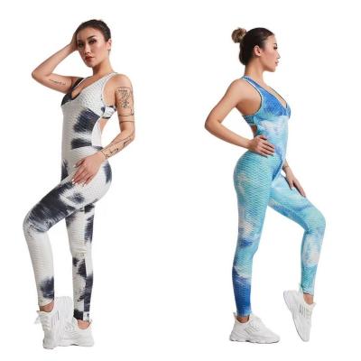 China Sexy High Stretch Hip Lifting Sports Fitness Pants Cross Back Tights Women's Yoga Backless Jumpsuit for sale