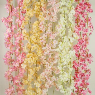 China Decorative Silk Wedding Garlands and Party Decoration Amazon Artificial Flower Hanging Wedding Fabric Wisteria Sakura Rattan Cherry Blossoms for sale