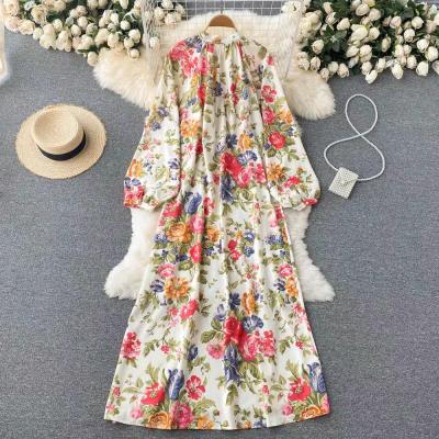 China Breathable elegant floral dress with loose waist covering and single breasted knee-length dress for sale