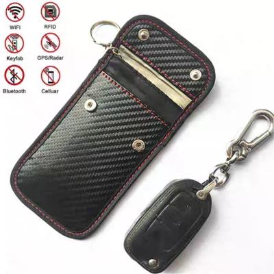 China Carbon Fiber +PU Leather Car Key Case FOB Bag Covers Blocker Holder RFID Blocking Pocket for sale