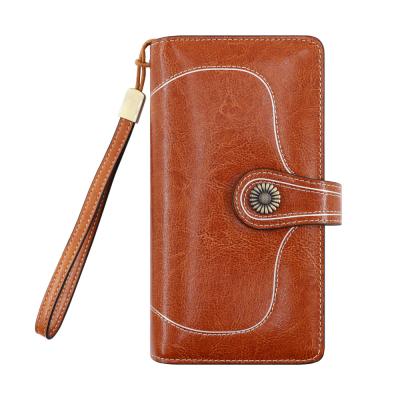 China rfid 2021 new arrival women large capacity rfid wrist wallet luxory genuine leather anti blocking genuine leather for sale