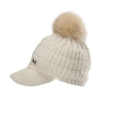 China COMMON Wholesale Winter Warm Knitted Hat With Faux Fur Pompom Hat For Women Girl for sale