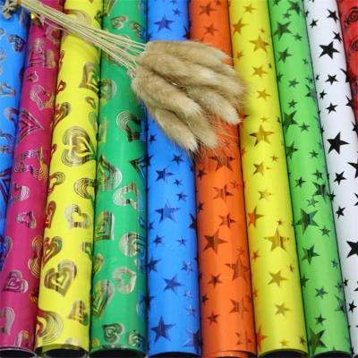 China Customized Floral Wrapping Paper Rainbow Moisture Proof Film Waterproof Cellophane Laser Colors Wholesale Christmas Gift for sale