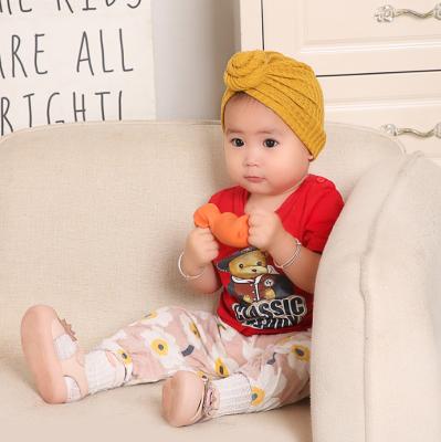 China European hot children's woolen sweater baby snail hat simple concise women's hair band new elastic hat and American hat for sale