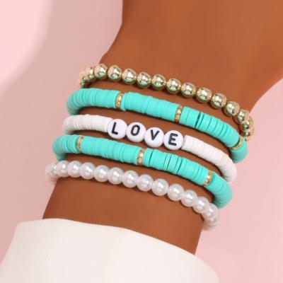 China Hot Selling High Quality Temperament Colored Clay Soft Bead Simple Concise Women's Hair Band Retro Charm Bead Elastic Bracelet Set for sale