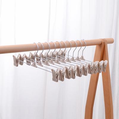 China Adjustable China Modern Daily Use I KNOW PP Hoop Pants Hanger With Clips for sale