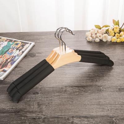 China Modern High Quality Non-slip I KNOW Strong Sponge Hanger Solid Wood Black for sale