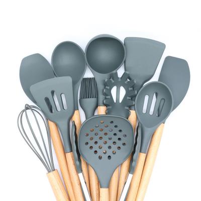 China Silicone+Wood factory direct sale 12 pieces of silicone kitchenware non-stick pan, spatula and spoon set for sale