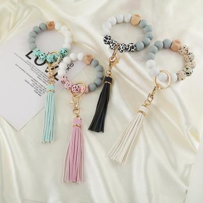 China Environmental Friendly Silicone Bead Key Chain, Silicone Wristband, Fringe Silicone Key Chain Wrist Strap for sale