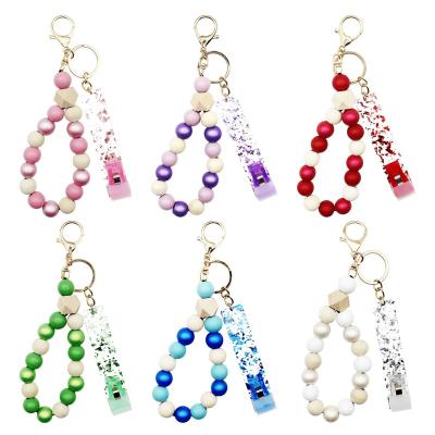 China Environmentally Friendly Wooden Bead Bracelet Keychain Fetcher Card Bank ATM Art Nail Protection Key Chain for sale