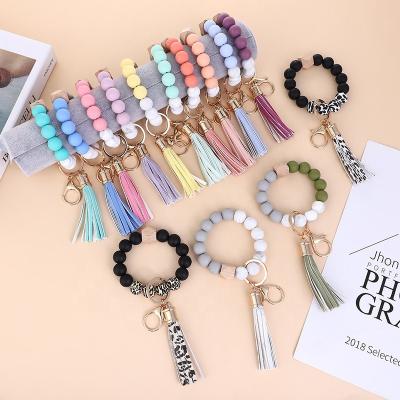 China New Silicone Bead Wristband Bracelet Key Chain Wooden Pendant Wrist Souvenir Gifts Promotion Anti-lost Key Chain for sale