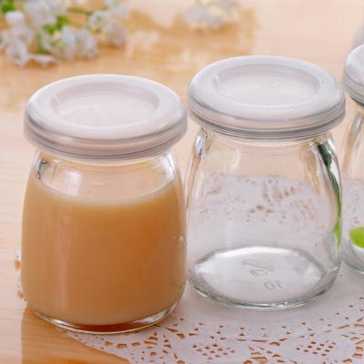 China Various Beverage Factory Price Flat Bottom Woman Rocket Shape For Pudding 0.79L Popular Cheap Glass Bottle Wholesale for sale