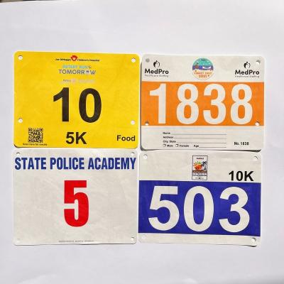 Cina Customized Race Numbers 0.5mm Thickness Tyvek Race Bib Numbers for Marathon Competition Triathlons in Rectangular Shape in vendita