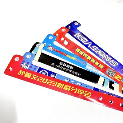 China Custom Logo Vinyl PVC Wristbands Promotion Gift Items L Shape One Layer PVC Waterproof Colorful Paper Wristband Bands for sale