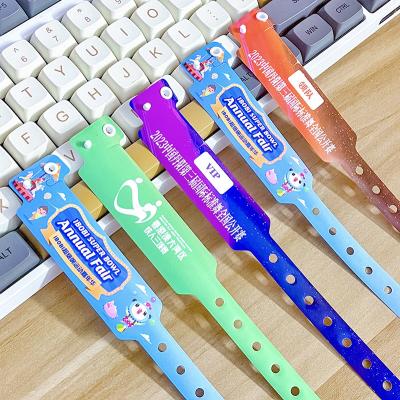 China Custom Logo Promotional Item Wristbands Vinyl One Layer PVC Waterproof Colorful Paper Bracelet Wristbands With Barcode for sale