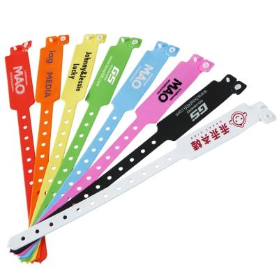 China Custom Disposable Wristband Plastic Vinyl PVC Neon Fluorescent Color Waterproof Event Party Gift Wristband for sale