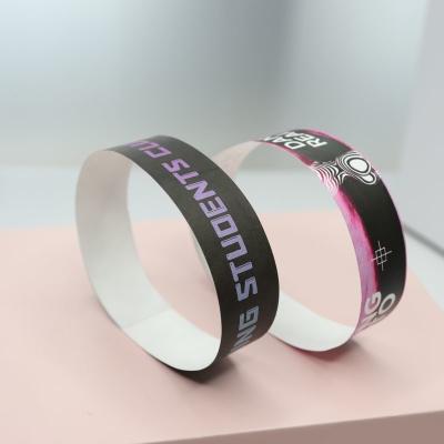 China Full Color Custom Logo Tyvek Wristbands Security Sequential Numbering Barcoding Various Colors for sale