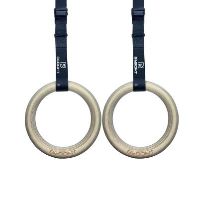 China Universal Workout Bodyweight Gym Wooden Ring Gymnastic Rings With Nylon Strap for sale