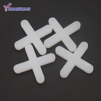 China 2mm Durable Locking Tile Spacers With Long White Cross Leg Tile Spacer for sale