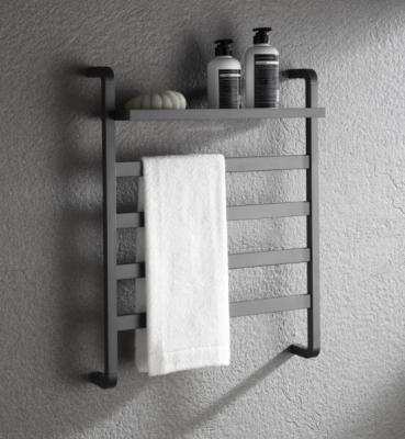 China Heater Modern Bathroom Electric Heated Towel Warmer With Shelf for sale