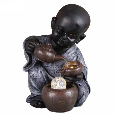 China Small modern cute polyresin monk water fountain for home use zu verkaufen