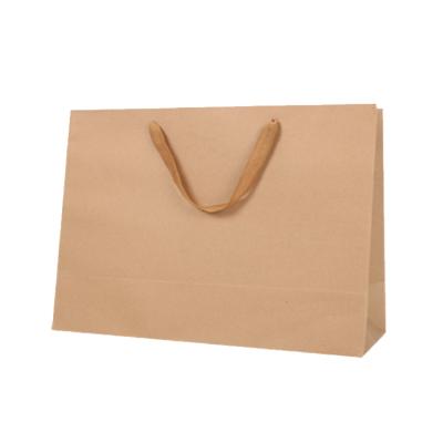 China Recycled Materials Customized Logo Design Luxury Paper Bag Gift Packaging Bag Paper Shopping Bag for sale