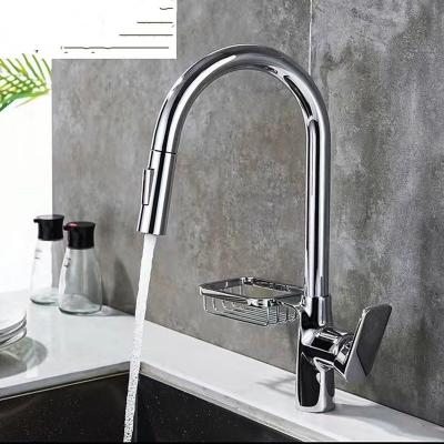 China Pull out spray latest brass material hot-selling drop-down kitchen faucet, with rotatable soap basket and sprayer for sale