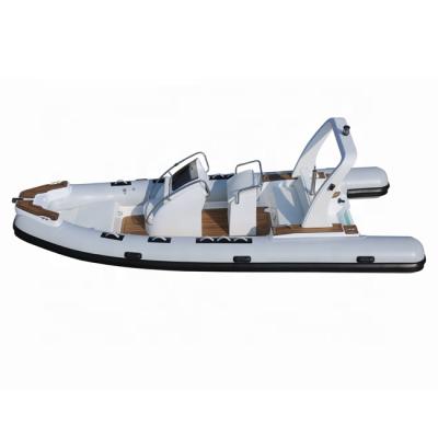 China Fiberglass RIB 580 Fiberglass Rigid Hull Inflatable Rowing Fishing Boat With Motor for sale