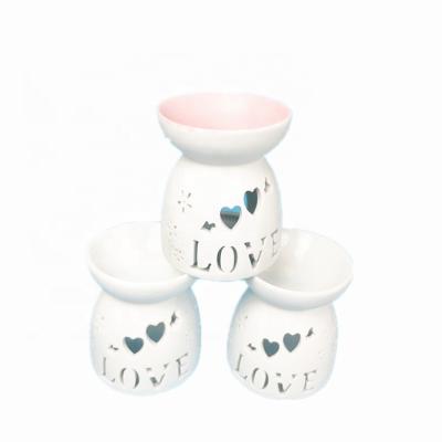 China Fashionable Decoration Porcelain Tea Light Holder Ceramic Essential Oil Burner for sale