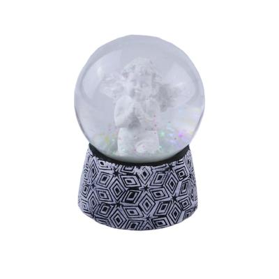 China Custom Acceptable Europe Angel Design White Resin Opens Musical Snow Globe Christmas for sale