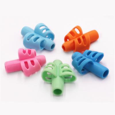 China Kids Pen Writing Aid Grip Good Quality Correcting Writing Posture Writing Aid Pencil Grips for Children Kids for sale