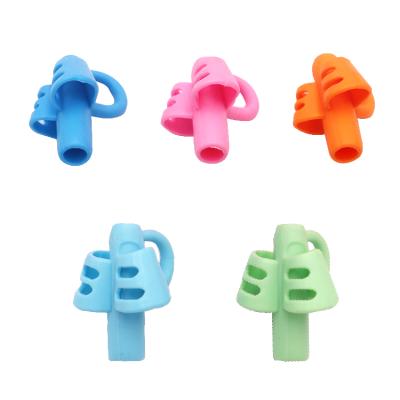 China Kids Pen Writing Aid Grip Three Fingers Writing Aid Pliers Trainer Pencil Grips For Student for sale