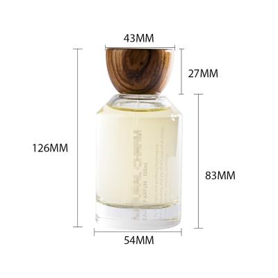 China Luxury Custom Crimp Packaging 30ml 50ml 100ml Glass Perfume Bottle Refillable Empty Wooden Cap for sale