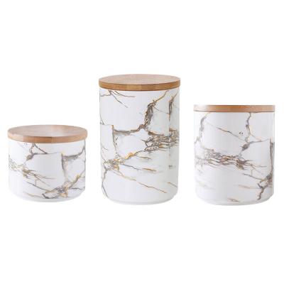 China Luxury Household Products Private Label Candle Jars With Wood Lid Bulk For Home Decor Empty Frosted Glass Candle Ships Container Holders for sale