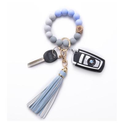 China YN Fashion Silicone Key Ring Bracelet for Women Beaded Key Chains Wristband Portable Tassel Key Chain Bracelet for sale