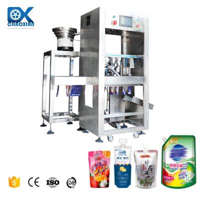 中国 Automatic Rotary Stand-Up Spout Bag Chemical Liquid Milk Premade Pouch Filling Packaging Machines 販売のため