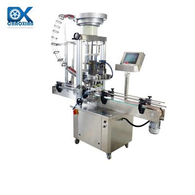 China High Speed Large Capacity Rotary Glass Bottle Automatic Capping Machine Jar Drinks Sealing Keg en venta